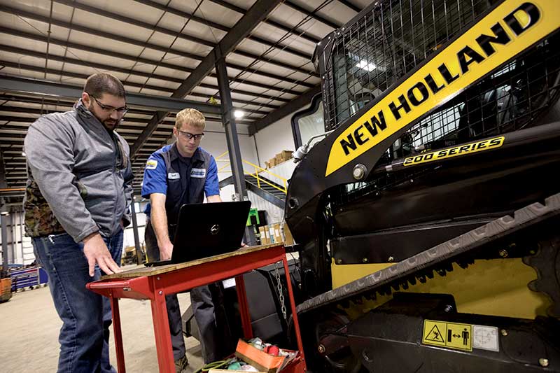 New Holland Skid Steer with Technician