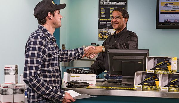 Service technician at store counter